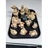A tray containing approximately sixteen oriental resin figures,