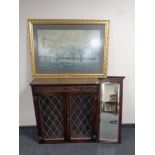 An oak leaded glass double door bookcase together with an Edwardian mahogany hall mirror and a gilt