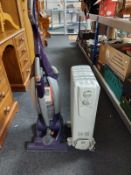 A Vax vacuum cleaner together with a DeLonghi heater
