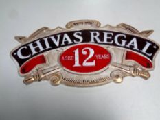 A cast iron Chivas Regal aged 12 years plaque