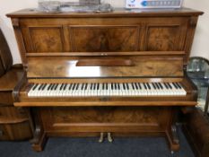 A walnut cased overstrung upright piano