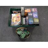 A box containing DVDs and VHS tapes including Buffy script,