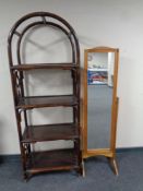 A set of bamboo and wicker arch topped shelves together with a pine cheval mirror