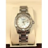 A lady's stainless steel Longines Conquest quartz calendar wristwatch with diamond set bezel and