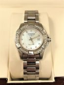 A lady's stainless steel Longines Conquest quartz calendar wristwatch with diamond set bezel and