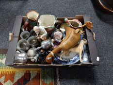 A box containing character jugs, pewter goblets, wooden duck figure,