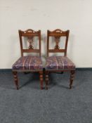 A pair of Edwardian walnut salon chairs in paisley upholstery