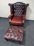 An oxblood leather Chesterfield wingback armchair on cabriole legs, width 87 cm,