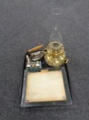 A tray containing pair of early 20th century glass picture frames, brass oil lamp,