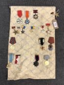 Approximately sixteen reproduction medals and badges of Russian/ Eastern European interest (16)