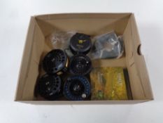 A box containing fly reels by Alpha and Mustang,