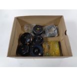 A box containing fly reels by Alpha and Mustang,