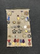 Approximately thirty-two reproduction medals and badges of Russian/ Eastern European interest (32)