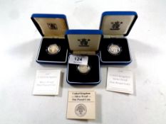 Three Royal Mint silver proof one pound coins, 1983, 1997 and 1998,