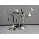 Eight various continental floor lamps