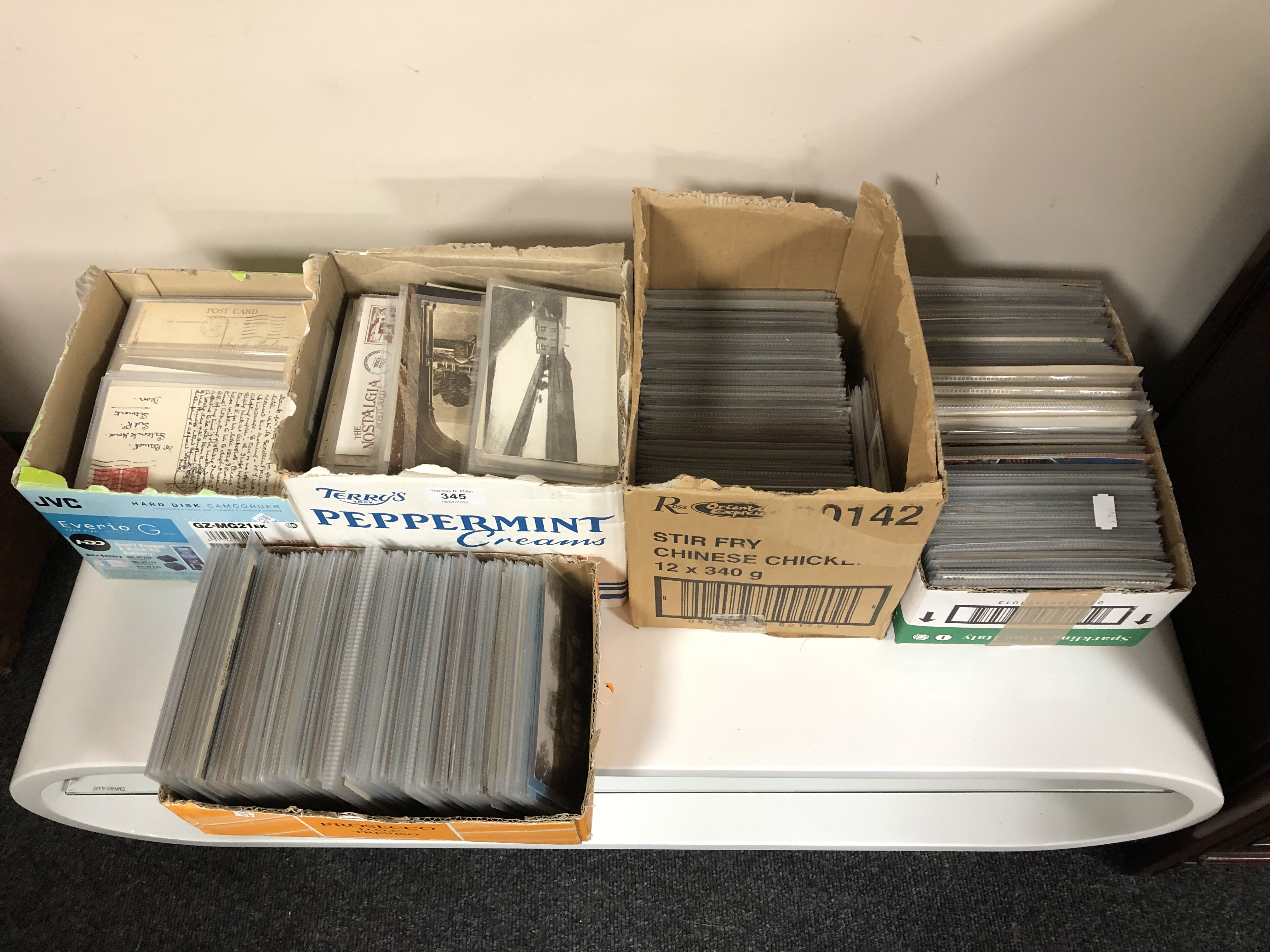 Five boxes containing a very large quantity of antiquarian postcards