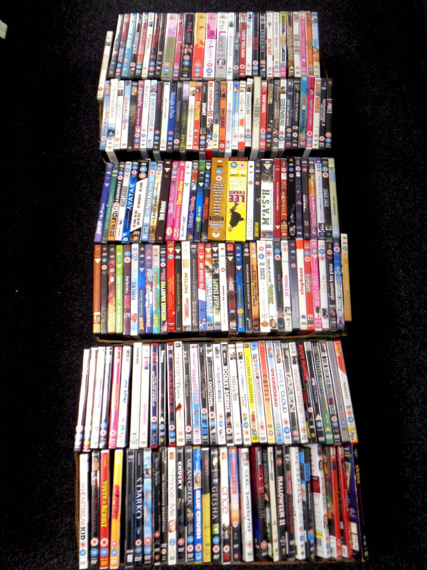 Three boxes containing a large quantity of DVDs,