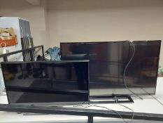 A Samsung 32'' LED TV monitor together with a Toshiba 42'' TV with leads and remotes