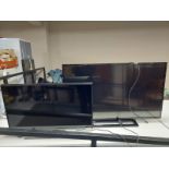 A Samsung 32'' LED TV monitor together with a Toshiba 42'' TV with leads and remotes