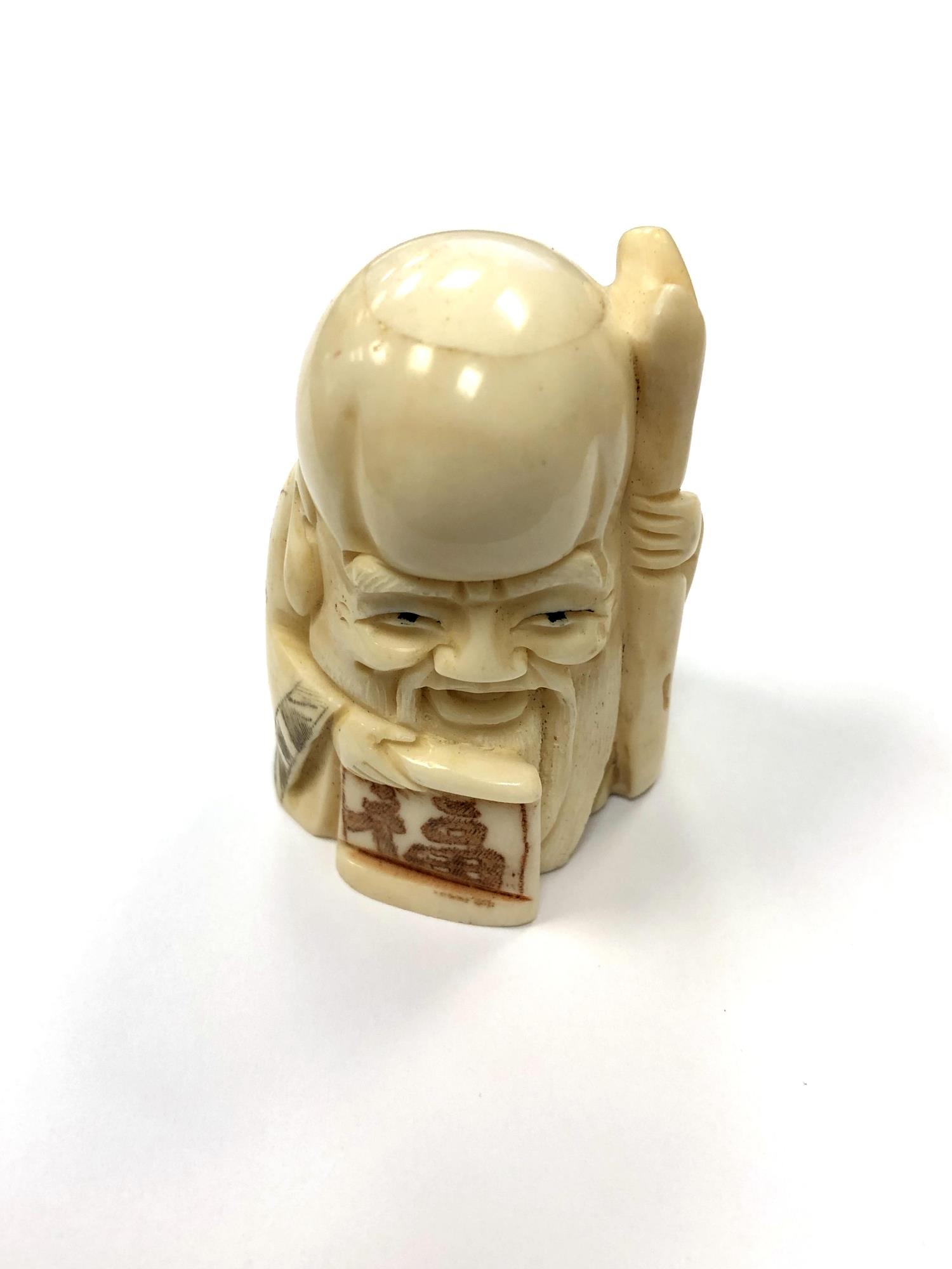 A Chinese bone netsuke - Village Elder with Stick.