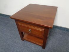 A contemporary lamp table fitted a drawer in a mahogany finish