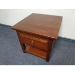 A contemporary lamp table fitted a drawer in a mahogany finish