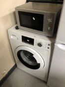 A Hisense washing machine together with a microwave