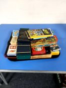 A tray containing playing cards, dominoes, tarot cards,