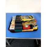 A tray containing playing cards, dominoes, tarot cards,