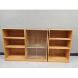 An oak effect three section low bookcase