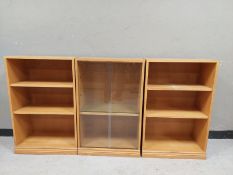 An oak effect three section low bookcase