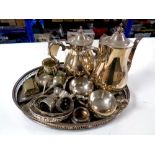 A silver plated gallery tray containing four piece tea service, plated napkin rings, cutlery,