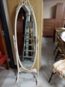 A contemporary cream and gilt cheval mirror