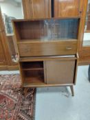 A walnut sliding door cocktail cabinet