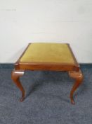 A beech footstool on cabriole legs