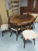 A good quality Titchmarsh and Goodwin oak oval dining table together with a set of eight dining