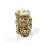 A Chinese bone netsuke - A Village Elder with a Basket of Wares.