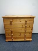 A pine five drawer chest with knob handles