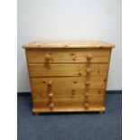 A pine five drawer chest with knob handles