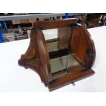 An Edwardian inlaid oak mirrored corner shelf