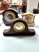 Two early 20th century oak mantel clocks together with a further onyx mantel clock