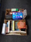 Two boxes containing vintage camera, Snoopy calendars, jigsaw puzzles, ziplock bags, tablet cases,