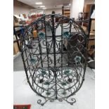 A contemporary wrought metal wine rack