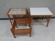 A continental teak tile topped table together with a melamine topped table and a teak planter