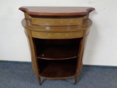 An Edwardian mahogany and satinwood inlaid bow fronted side cabinet (lacks door)