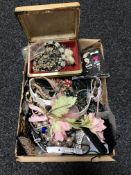 A box containing a collection of costume jewellery,