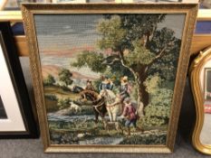 A gilt framed tapestry depicting a hunt,