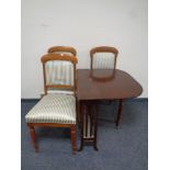 An antique mahogany Sutherland table together with a set of three dining chairs upholstered in a