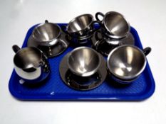 A tray containing fourteen pieces of contemporary stainless steel tea ware by Imperial and CAA