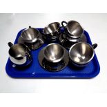 A tray containing fourteen pieces of contemporary stainless steel tea ware by Imperial and CAA